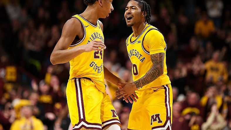 Feb 22, 2024; Minneapolis, Minnesota, USA; Minnesota Golden Gophers guard Elijah Hawkins (0) celebrates after guard Cam Christie's (24) three-point basket against the Ohio State Buckeyes during the second half at Williams Arena. Mandatory Credit: Matt Krohn-USA TODAY Sports