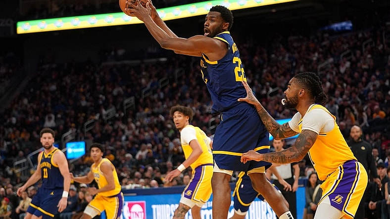 Feb 22, 2024; San Francisco, California, USA; Golden State Warriors forward Andrew Wiggins (22) holds onto a pass against the Los Angeles Lakers in the fourth quarter at the Chase Center. Mandatory Credit: Cary Edmondson-USA TODAY Sports