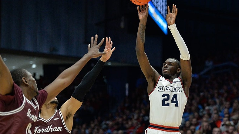 Feb 17, 2024; Dayton, Ohio, USA;  Dayton Flyers guard Kobe Elvis (24) shoots the ball against Fordham guard Antrell Charlton (24) during the game at University of Dayton Arena. Mandatory Credit: Matt Lunsford-USA TODAY Sports