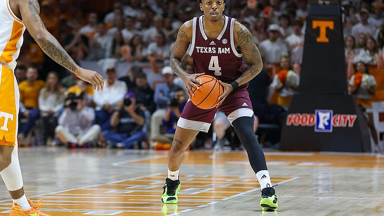 Feb 24, 2024; Knoxville, Tennessee, USA; Texas A&M Aggies guard Wade Taylor IV (4) looks to pass the ball against the Tennessee Volunteers during the first half at Thompson-Boling Arena at Food City Center. Mandatory Credit: Randy Sartin-USA TODAY Sports