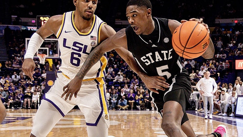 Feb 24, 2024; Baton Rouge, Louisiana, USA; Mississippi State Bulldogs guard Shawn Jones Jr. (5) drives to the basket against LSU Tigers guard Jordan Wright (6) during the second half at Pete Maravich Assembly Center. Mandatory Credit: Stephen Lew-USA TODAY Sports