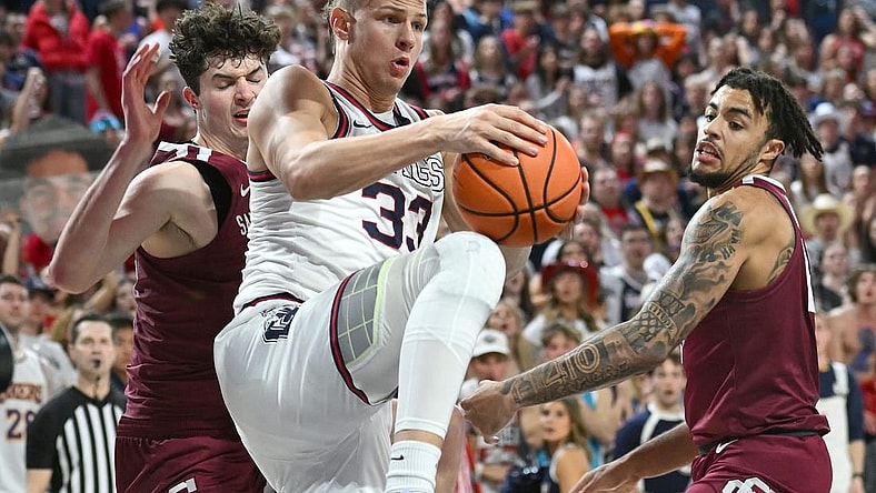 Feb 24, 2024; Spokane, Washington, USA; Gonzaga Bulldogs forward Ben Gregg (33) rebounds the ball against Santa Clara Broncos forward Johnny O'Neil (14) in the second half at McCarthey Athletic Center. Gonzaga Bulldogs won 94-81. Mandatory Credit: James Snook-USA TODAY Sports