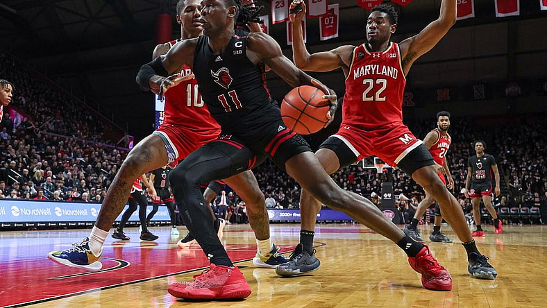 Feb 25, 2024; Piscataway, New Jersey, USA; Rutgers Scarlet Knights center Clifford Omoruyi (11) dribbles in front of Maryland Terrapins forward Julian Reese (10) and forward Jordan Geronimo (22) during the second half at Jersey Mike's Arena. Mandatory Credit: Vincent Carchietta-USA TODAY Sports