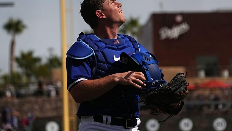 Feb 25, 2024; Phoenix, Arizona, USA; Los Angeles Dodgers catcher Will Smith (16) looks on against the Oakland Athletics during the second inning at Camelback Ranch-Glendale. Mandatory Credit: Joe Camporeale-USA TODAY Sports