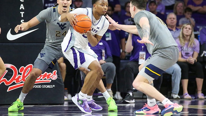 Feb 26, 2024; Manhattan, Kansas, USA; Kansas State Wildcats guard Tylor Perry (2) is dribbles as West Virginia Mountaineers forwards Patrick Suemnick (24) and Quinn Slazinski (11) defend during overtime at Bramlage Coliseum. Mandatory Credit: Scott Sewell-USA TODAY Sports