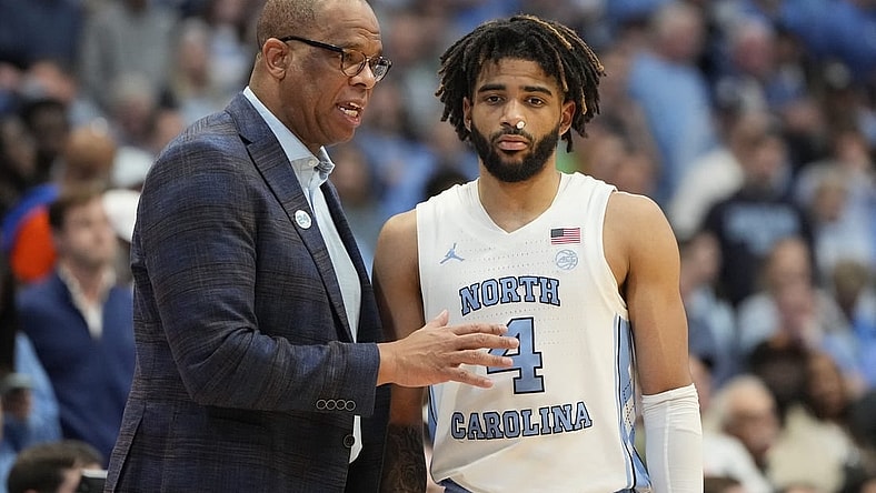Feb 26, 2024; Chapel Hill, North Carolina, USA; North Carolina Tar Heels coach Hubert Davis with guard RJ Davis (4) in the second half at Dean E. Smith Center. Mandatory Credit: Bob Donnan-USA TODAY Sports