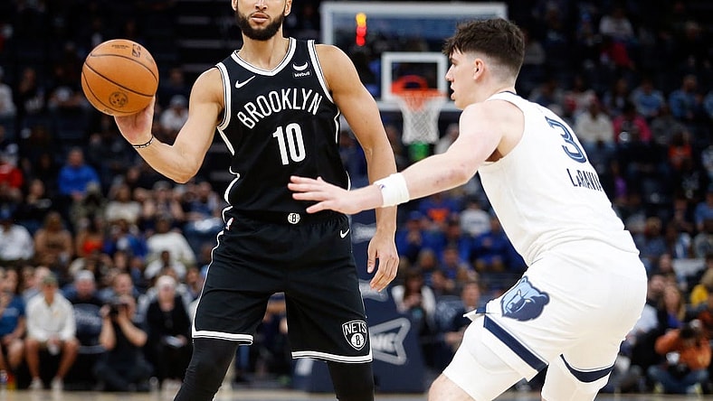 Feb 26, 2024; Memphis, Tennessee, USA; Brooklyn Nets guard Ben Simmons (10) passes the ball as Memphis Grizzlies forward Jake LaRavia (3) defends during the second half at FedExForum. Mandatory Credit: Petre Thomas-USA TODAY Sports