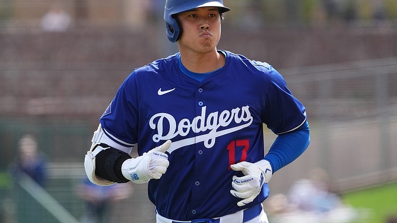 Feb 27, 2024; Phoenix, Arizona, USA; Los Angeles Dodgers designated hitter Shohei Ohtani (17) returns to the dugout after grounding into a double play during the third inning against the Chicago White Sox at Camelback Ranch-Glendale. Mandatory Credit: Joe Camporeale-USA TODAY Sports