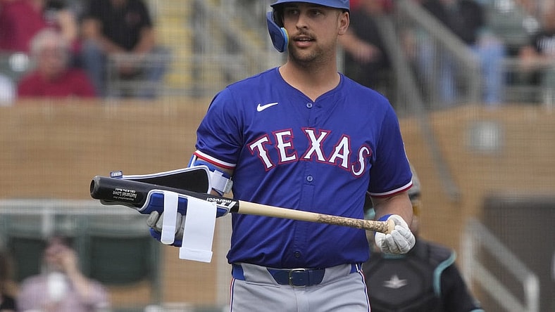 Feb 27, 2024; Salt River Pima-Maricopa, Arizona, USA; Texas Rangers first baseman Nathaniel Lowe (30) reacts after walking against the Arizona Diamondbacks during the first inning at Salt River Fields at Talking Stick. Mandatory Credit: Rick Scuteri-USA TODAY Sports