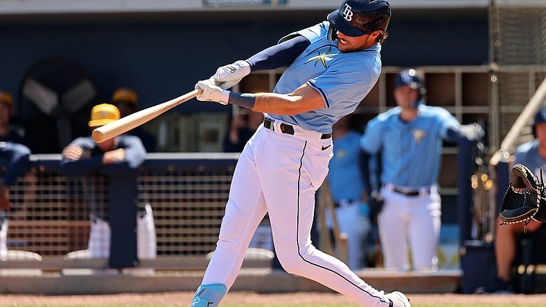 Feb 27, 2024; Port Charlotte, Florida, USA;  Tampa Bay Rays right fielder Josh Lowe (15) doubles during the second inning against the New York Yankees at Charlotte Sports Park. Mandatory Credit: Kim Klement Neitzel-USA TODAY Sports