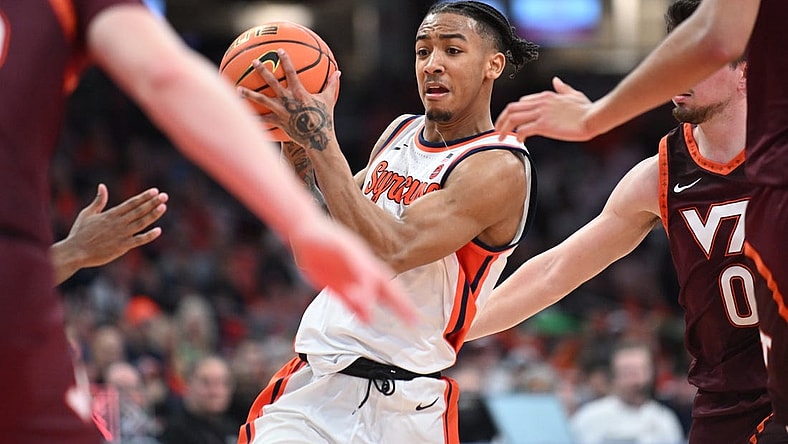 Feb 27, 2024; Syracuse, New York, USA; Syracuse Orange guard Judah Mintz handles the ball in traffic against the Virginia Tech Hokies in the second half at the JMA Wireless Dome. Mandatory Credit: Mark Konezny-USA TODAY Sports