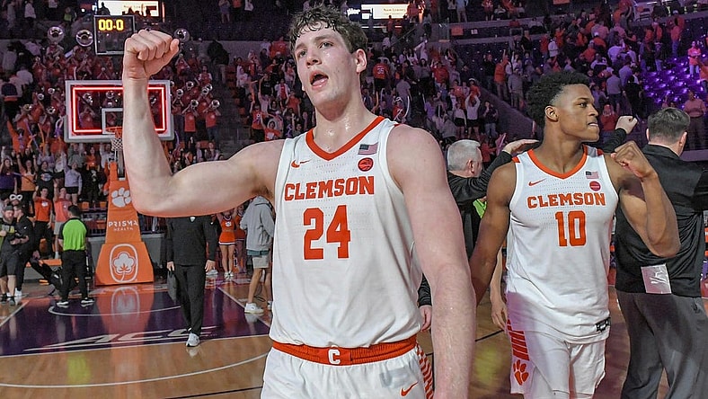 Feb 27, 2024; Clemson, South Carolina, USA; Clemson junior forward PJ Hall (24) and RJ Godfrey (10) celebrate after the Tigers beat Pitt 69-62 at Littlejohn Coliseum. Mandatory Credit: Ken Ruinard-USA TODAY Sports
