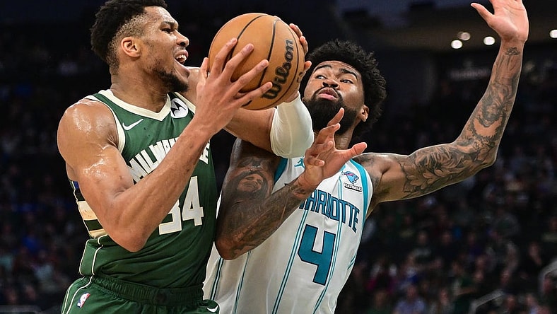 Feb 27, 2024; Milwaukee, Wisconsin, USA; Milwaukee Bucks forward Giannis Antetokounmpo (34) drives for the basket against Charlotte Hornets center Nick Richards (4) in the third quarter at Fiserv Forum. Mandatory Credit: Benny Sieu-USA TODAY Sports