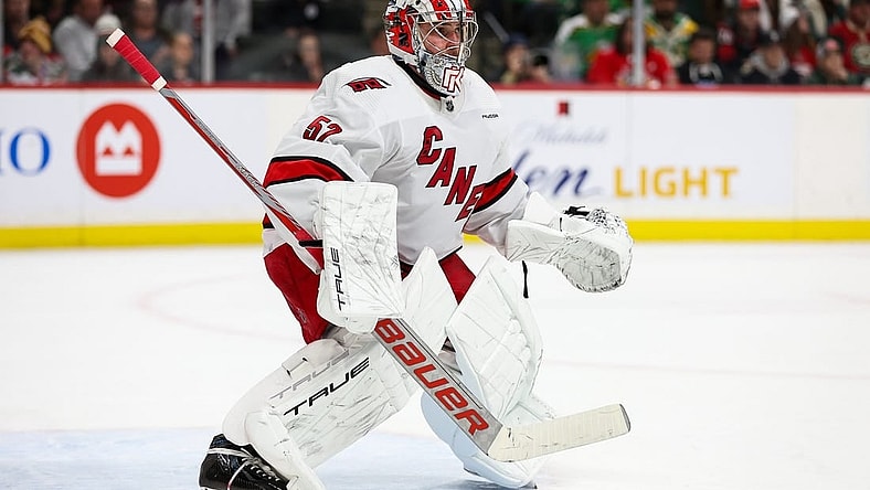 Feb 27, 2024; Saint Paul, Minnesota, USA; Carolina Hurricanes goaltender Pyotr Kochetkov (52) defends his net against the Minnesota Wild during the second period at Xcel Energy Center. Mandatory Credit: Matt Krohn-USA TODAY Sports