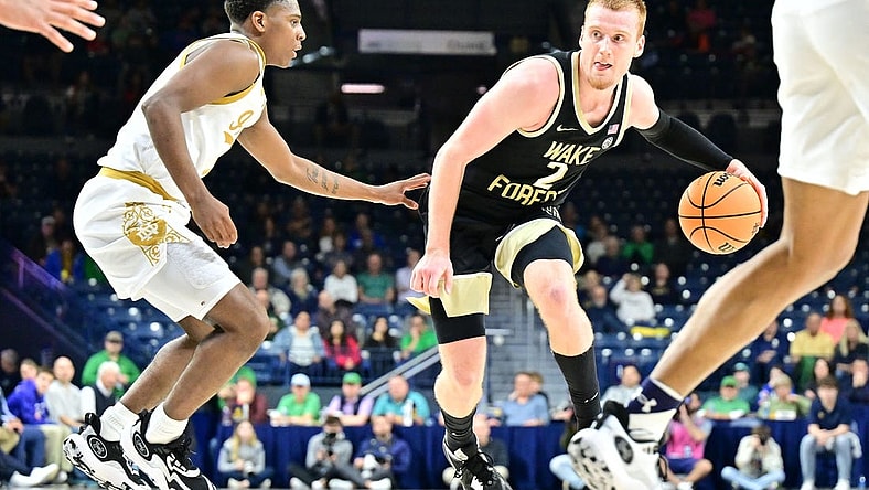 Feb 27, 2024; South Bend, Indiana, USA; Wake Forest Demon Deacons guard Cameron Hildreth (2) dribbles as Notre Dame Fighting Irish guard Markus Burton (3) defends in the second half at the Purcell Pavilion. Mandatory Credit: Matt Cashore-USA TODAY Sports