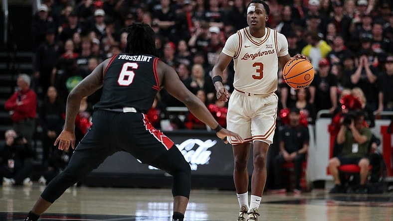 Feb 27, 2024; Lubbock, Texas, USA;  UT Longhorns guard Max Abmas (3) dribbles the ball against Texas Tech Red Raiders guard Joe Toussaint (6) in the first half at United Supermarkets Arena. Mandatory Credit: Michael C. Johnson-USA TODAY Sports