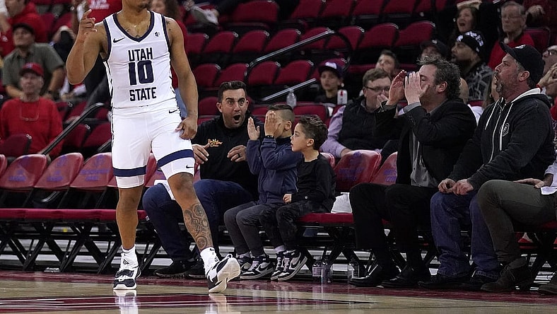 Feb 27, 2024; Fresno, California, USA; Utah State Aggies guard Darius Brown II (10) reacts after making a three point shot against the Fresno State Bulldogs with under two second remaining in the second half at the Save Mart Center. Mandatory Credit: Cary Edmondson-USA TODAY Sports