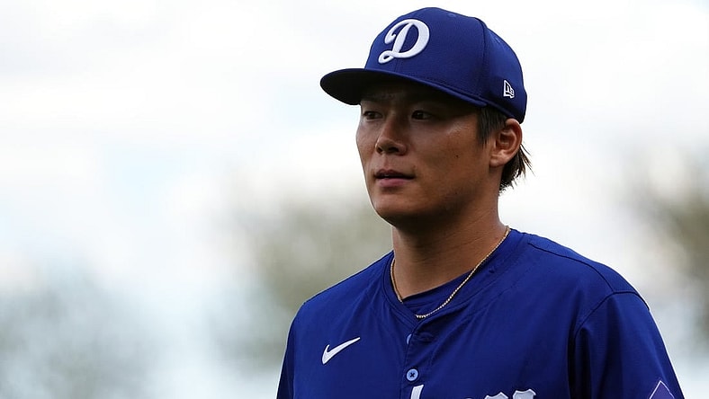 Feb 28, 2024; Surprise, Arizona, USA; Los Angeles Dodgers starting pitcher Yoshinobu Yamamoto (18) returns to the dugout during the first inning against the Texas Rangers at Surprise Stadium. Mandatory Credit: Joe Camporeale-USA TODAY Sports