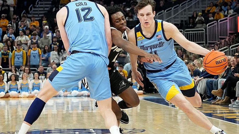 Marquette guard Tyler Kolek (11) takes advantage of a pick by forward Ben Gold (12) on guard Jayden Pierre (1) during the first half of their game Wednesday, February 28, 2024 at Fiserv Forum in Milwaukee, WisconsinMark Hoffman/Milwaukee Journal Sentinel