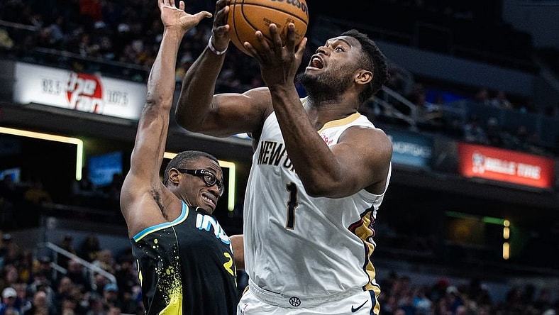 Feb 28, 2024; Indianapolis, Indiana, USA; New Orleans Pelicans forward Zion Williamson (1) shoots the ball while Indiana Pacers forward Jalen Smith (25) defends in the first half at Gainbridge Fieldhouse. Mandatory Credit: Trevor Ruszkowski-USA TODAY Sports
