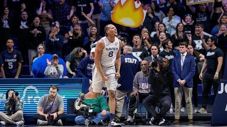 Xavier Musketeers guard Quincy Olivari (8) celebrates in the second half of the NCAA Big East conference basketball game between the Xavier Musketeers and the DePaul Blue Demons at the Cintas Center in Cincinnati on Wednesday, Feb. 28, 2024.