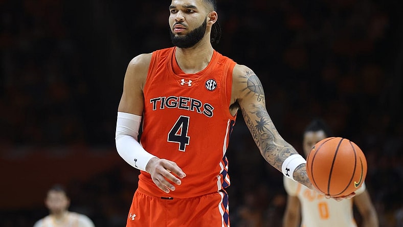 Feb 28, 2024; Knoxville, Tennessee, USA; Auburn Tigers forward Johni Broome (4) looks to move the ball against the Tennessee Volunteers during the second half at Thompson-Boling Arena at Food City Center. Mandatory Credit: Randy Sartin-USA TODAY Sports