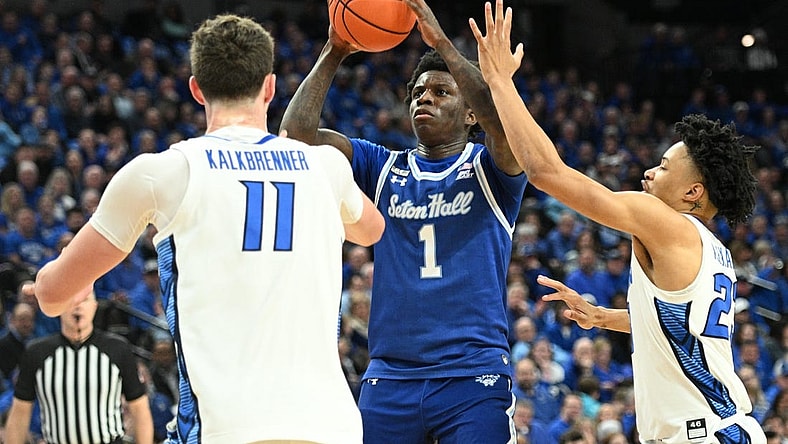 Feb 28, 2024; Omaha, Nebraska, USA; Seton Hall Pirates guard Kadary Richmond (1) shoots over Creighton Bluejays center Ryan Kalkbrenner (11) and guard Trey Alexander (23) in the first half at CHI Health Center Omaha. Mandatory Credit: Steven Branscombe-USA TODAY Sports