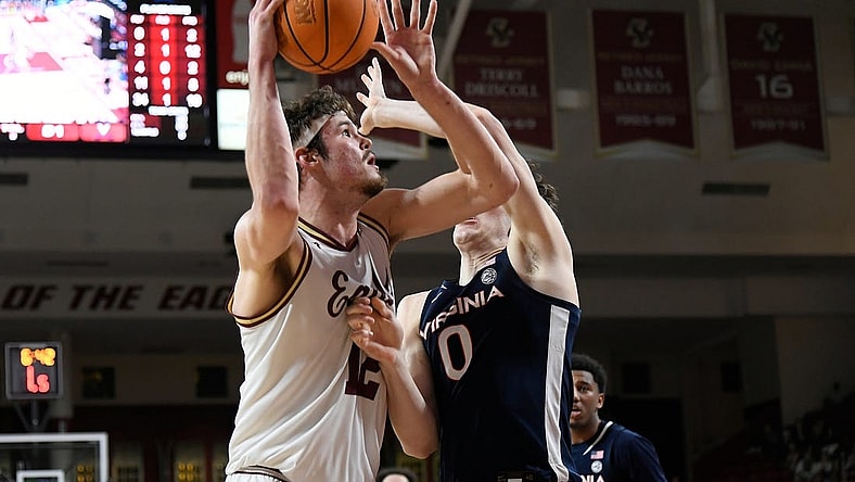 Feb 28, 2024; Chestnut Hill, Massachusetts, USA; Boston College Eagles forward Quinten Post (12) shoots the ball  against Virginia Cavaliers forward Blake Buchanan (0) during the second half at Conte Forum. Mandatory Credit: Eric Canha-USA TODAY Sports