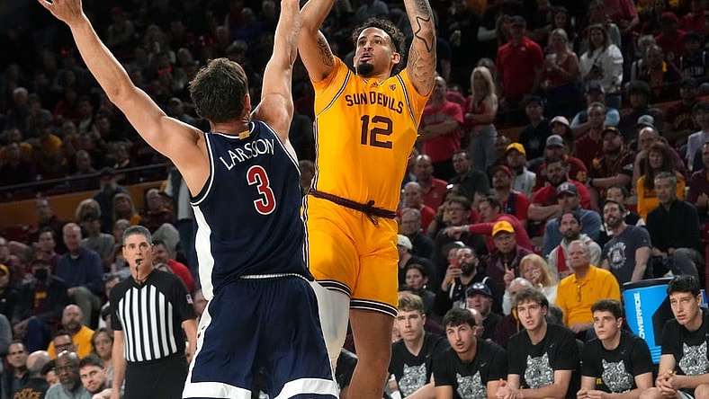 ASU Sun Devils guard Jose Perez (12) shoots the ball over UA Wildcats guard Pelle Larsson (3) at Desert Financial Arena in Tempe on Feb. 28, 2024.
