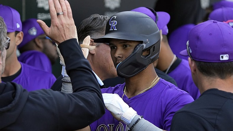 Feb 29, 2024; Mesa, Arizona, USA; Colorado Rockies shortstop Ezequiel Tovar (14) celebrates with teammates after hitting a solo home run against the Chicago Cubs in the third inning at Sloan Park. Mandatory Credit: Rick Scuteri-USA TODAY Sports