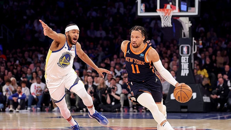 Feb 29, 2024; New York, New York, USA; New York Knicks guard Jalen Brunson (11) controls the ball against Golden State Warriors guard Moses Moody (4) during the first quarter at Madison Square Garden. Mandatory Credit: Brad Penner-USA TODAY Sports