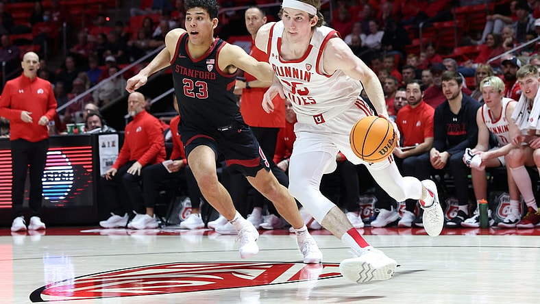 Feb 29, 2024; Salt Lake City, Utah, USA; Utah Utes center Branden Carlson (35) drives to the basket against Stanford Cardinal forward Brandon Angel (23) during the second half at Jon M. Huntsman Center. Mandatory Credit: Rob Gray-USA TODAY Sports
