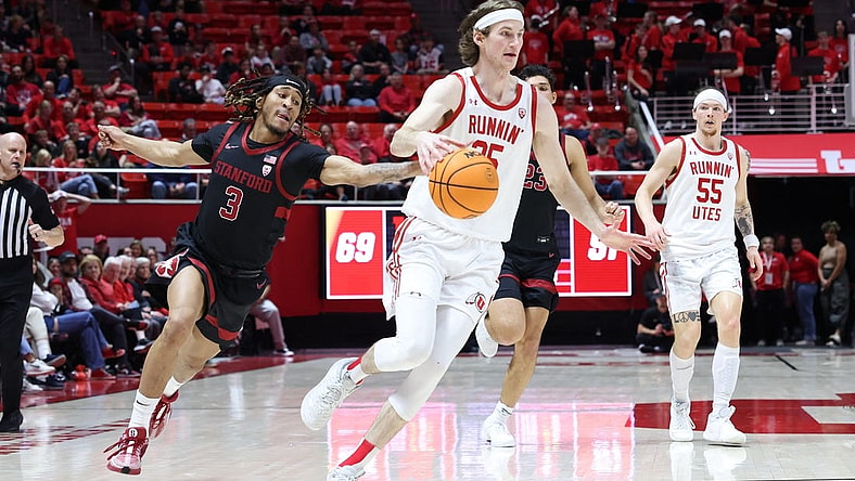Feb 29, 2024; Salt Lake City, Utah, USA; Stanford Cardinal guard Kanaan Carlyle (3) knocks the ball away from Utah Utes center Branden Carlson (35) during the second half at Jon M. Huntsman Center. Mandatory Credit: Rob Gray-USA TODAY Sports