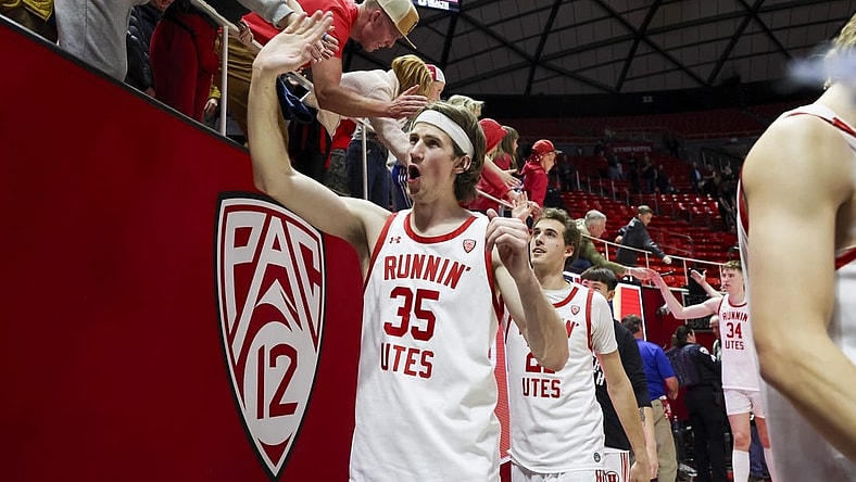 Feb 29, 2024; Salt Lake City, Utah, USA; Utah Utes center Branden Carlson (35) slaps hands with fans after the win against the Stanford Cardinal at Jon M. Huntsman Center. Mandatory Credit: Rob Gray-USA TODAY Sports