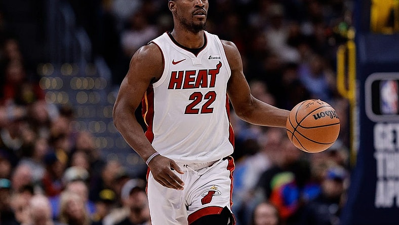 Feb 29, 2024; Denver, Colorado, USA; Miami Heat forward Jimmy Butler (22) dribbles the ball up court in the fourth quarter against the Denver Nuggets at Ball Arena. Mandatory Credit: Isaiah J. Downing-USA TODAY Sports