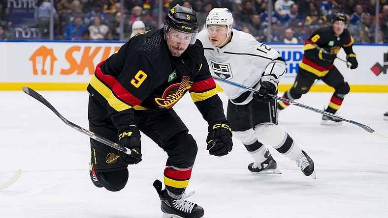 Feb 29, 2024; Vancouver, British Columbia, CAN; Vancouver Canucks forward J.T. Miller (9) skates after the loose puck against the Los Angeles Kings in the third period at Rogers Arena. Kings won 5-1. Mandatory Credit: Bob Frid-USA TODAY Sports