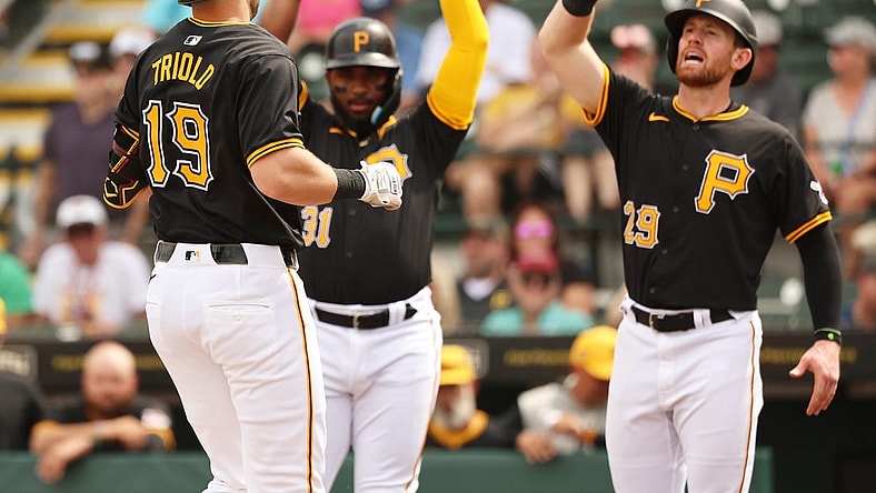 Mar 1, 2024; Bradenton, Florida, USA;  Pittsburgh Pirates third baseman Jared Triolo (19) is congratulated after he hit a 3-run home run during the second inning against the Tampa Bay Rays at LECOM Park. Mandatory Credit: Kim Klement Neitzel-USA TODAY Sports