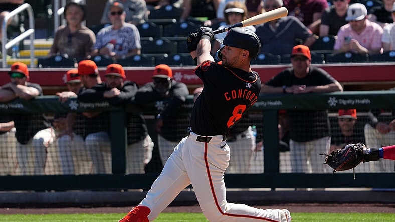 Mar 1, 2024; Scottsdale, Arizona, USA; San Francisco Giants left fielder Michael Conforto (8) bats against the Texas Rangers during the first inning at Scottsdale Stadium. Mandatory Credit: Joe Camporeale-USA TODAY Sports