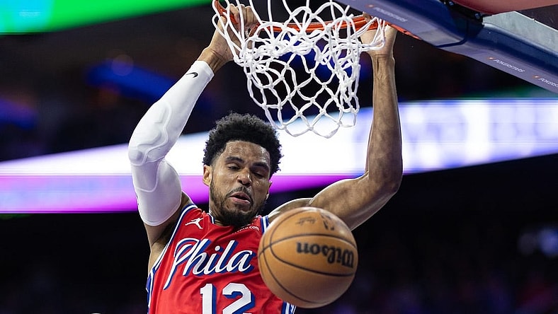 Mar 1, 2024; Philadelphia, Pennsylvania, USA; Philadelphia 76ers forward Tobias Harris (12) dunks the ball against the Charlotte Hornets during the second quarter at Wells Fargo Center. Mandatory Credit: Bill Streicher-USA TODAY Sports