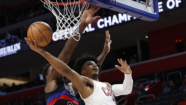 Mar 1, 2024; Detroit, Michigan, USA;  Cleveland Cavaliers forward Isaac Okoro (35) shoots on Detroit Pistons center Jalen Duren (0) in the first half at Little Caesars Arena. Mandatory Credit: Rick Osentoski-USA TODAY Sports