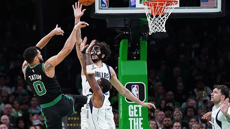Mar 1, 2024; Boston, Massachusetts, USA; Dallas Mavericks center Dereck Lively II (2) and guard Kyrie Irving (11) defend against Boston Celtics forward Jayson Tatum (0) in the second quarter at TD Garden. Mandatory Credit: David Butler II-USA TODAY Sports