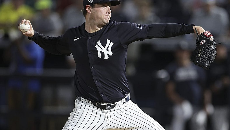 Mar 1, 2024; Tampa, Florida, USA;  New York Yankees starting pitcher Gerrit Cole (45) throws a pitch against the Toronto Blue Jays in the first inning at George M. Steinbrenner Field. Mandatory Credit: Nathan Ray Seebeck-USA TODAY Sports