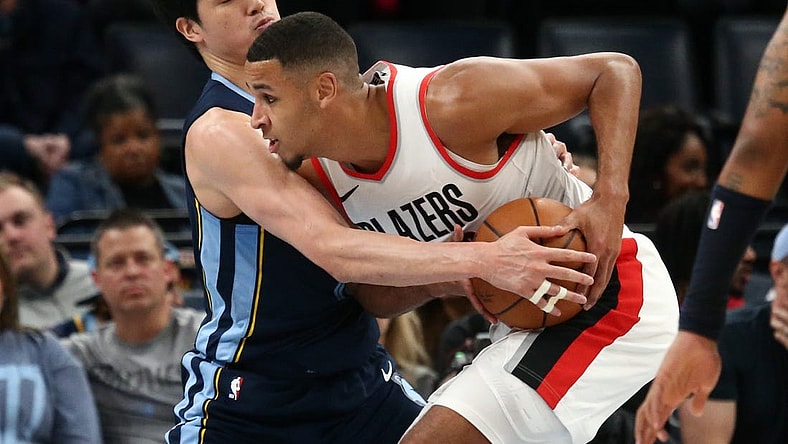 Mar 1, 2024; Memphis, Tennessee, USA; Portland Trail Blazers forward Kris Murray (8) drives to the basket as Memphis Grizzlies forward Yuta Watanabe (18) defends during the second half at FedExForum. Mandatory Credit: Petre Thomas-USA TODAY Sports