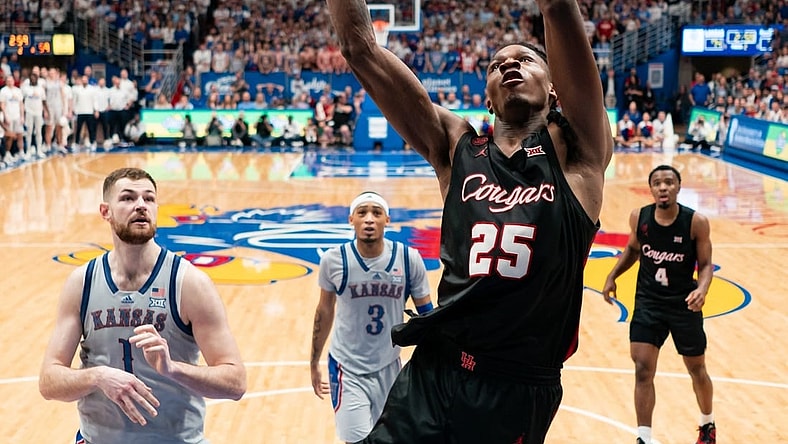 Feb 3, 2024; Lawrence, Kansas, USA; Houston Cougars forward Joseph Tugler (25) dunks the ball against the Kansas Jayhawks during the second half at Allen Fieldhouse. Mandatory Credit: Jay Biggerstaff-USA TODAY Sports