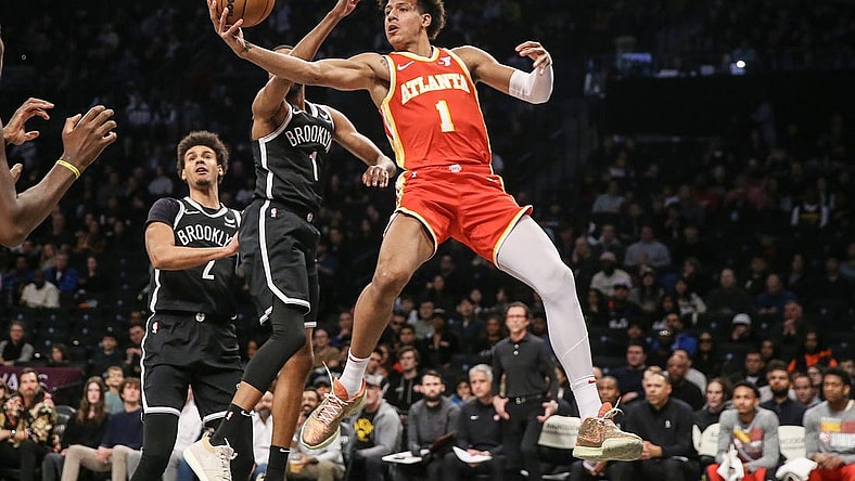 Mar 2, 2024; Brooklyn, New York, USA; Atlanta Hawks forward Jalen Johnson (1) drives past Brooklyn Nets forward Mikal Bridges (1) in the first quarter at Barclays Center. Mandatory Credit: Wendell Cruz-USA TODAY Sports