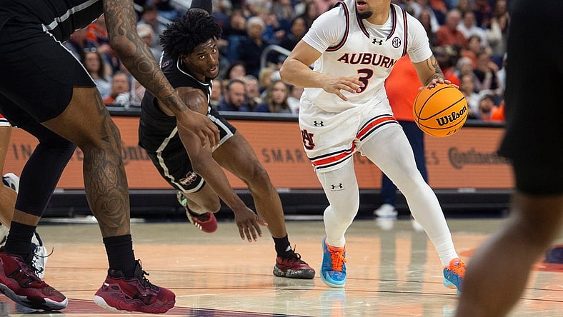 Auburn Tigers guard Tre Donaldson (3) drives the ball as Auburn Tigers take on Mississippi State Bulldogs at Neville Arena in Auburn, Ala., on Saturday, March 2, 2024. Auburn Tigers lead Mississippi State Bulldogs 39-22 at halftime.