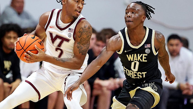 Mar 2, 2024; Blacksburg, Virginia, USA; Virginia Tech Hokies guard MJ Collins (2) handles the ball against Wake Forest Demon Deacons guard Kevin Miller (0) during the first half at Cassell Coliseum. Mandatory Credit: Peter Casey-USA TODAY Sports