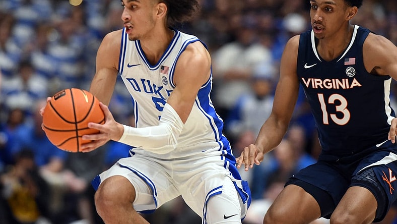 Mar 2, 2024; Durham, North Carolina, USA; Duke Blue Devils guard Tyrese Proctor (5) tracks down a loose ball in front of Virginia Cavaliers guard Ryan Dunn (13) during the first half at Cameron Indoor Stadium. Mandatory Credit: Rob Kinnan-USA TODAY Sports