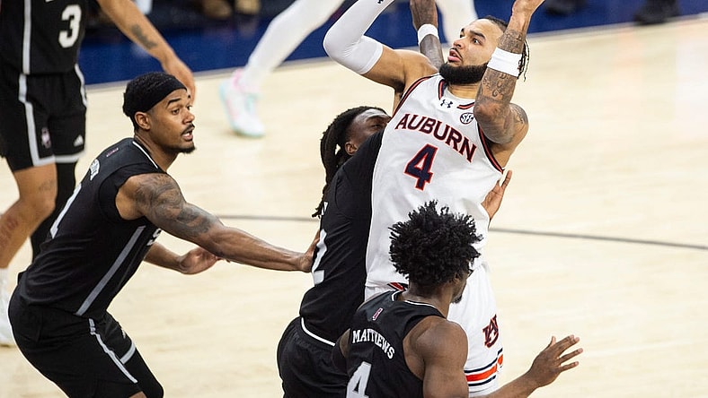 Auburn Tigers forward Johni Broome (4) goes up for a layup as Auburn Tigers take on Mississippi State Bulldogs at Neville Arena in Auburn, Ala., on Saturday, March 2, 2024. Auburn Tigers defeated Mississippi State Bulldogs 78-63.