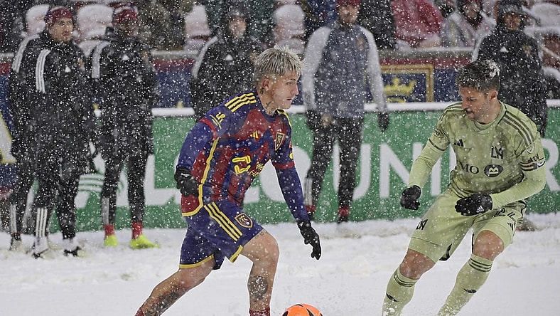 Mar 2, 2024; Sandy, Utah, USA;  Real Salt Lake midfielder Diego Luna (8) is defended by LAFC defender Ryan Hollingshead (24) at America First Field. Mandatory Credit: Christopher Creveling-USA TODAY Sports